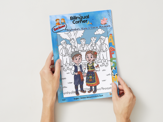 Coloring book titled 'Bilingual Corner Jr.' held by a person on a white background